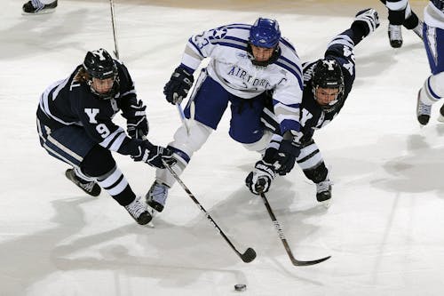 Free Men's in Blue and White Jersey Shirt Playing Hockey Stock Photo