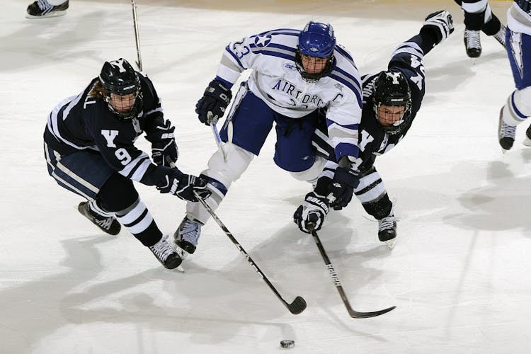 Men's In Blue And White Jersey Shirt Playing Hockey