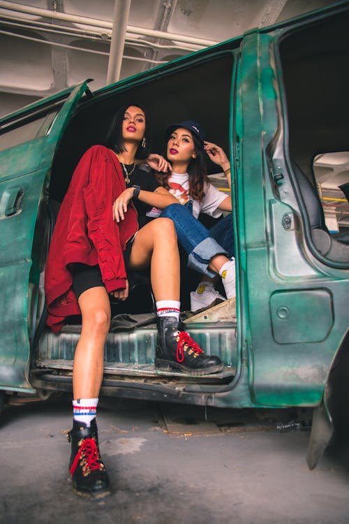 Two Women Sitting in Vehicle