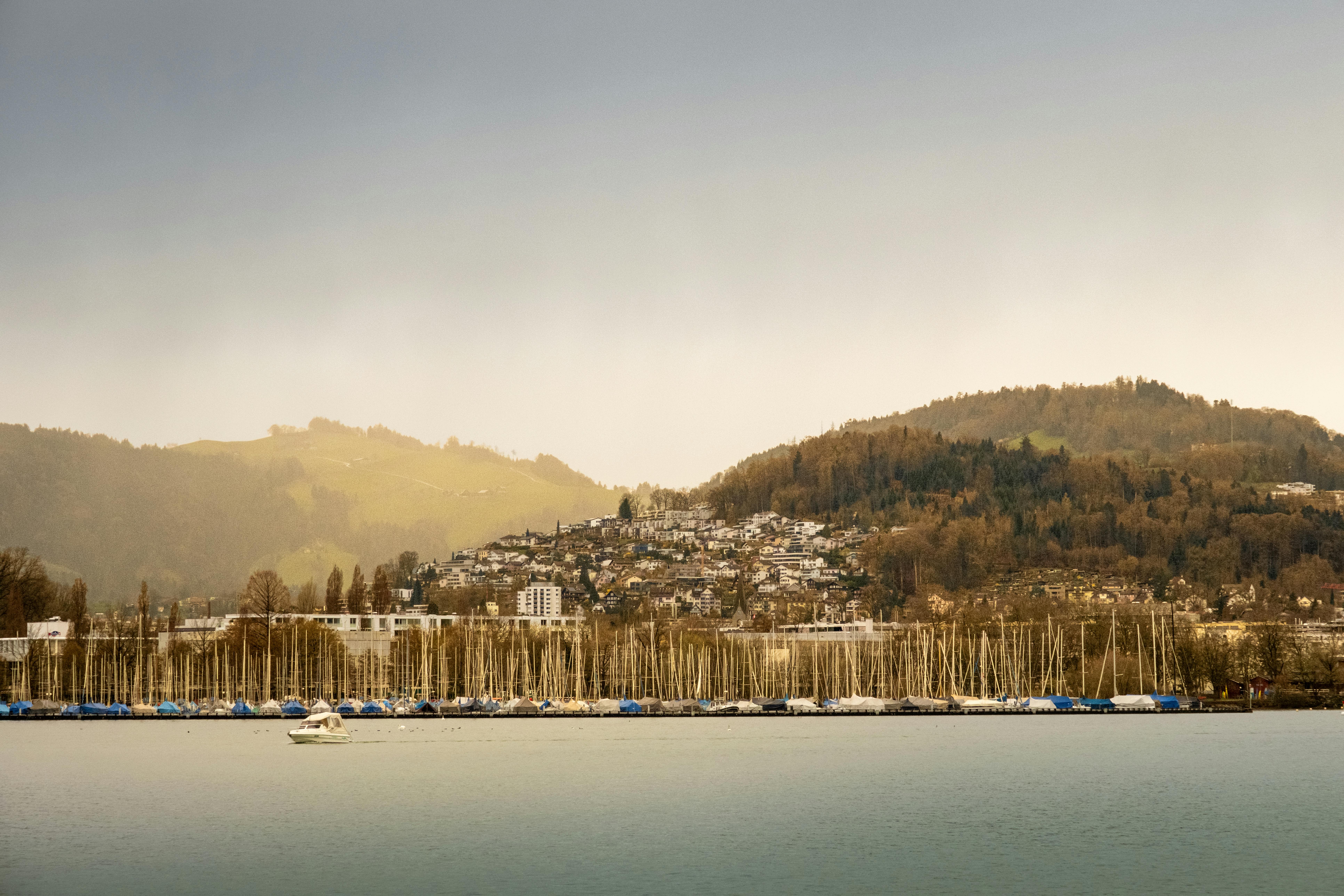 Captivating view of Lake Lucerne, Switzerland, showcasing boats docked against scenic hills.
