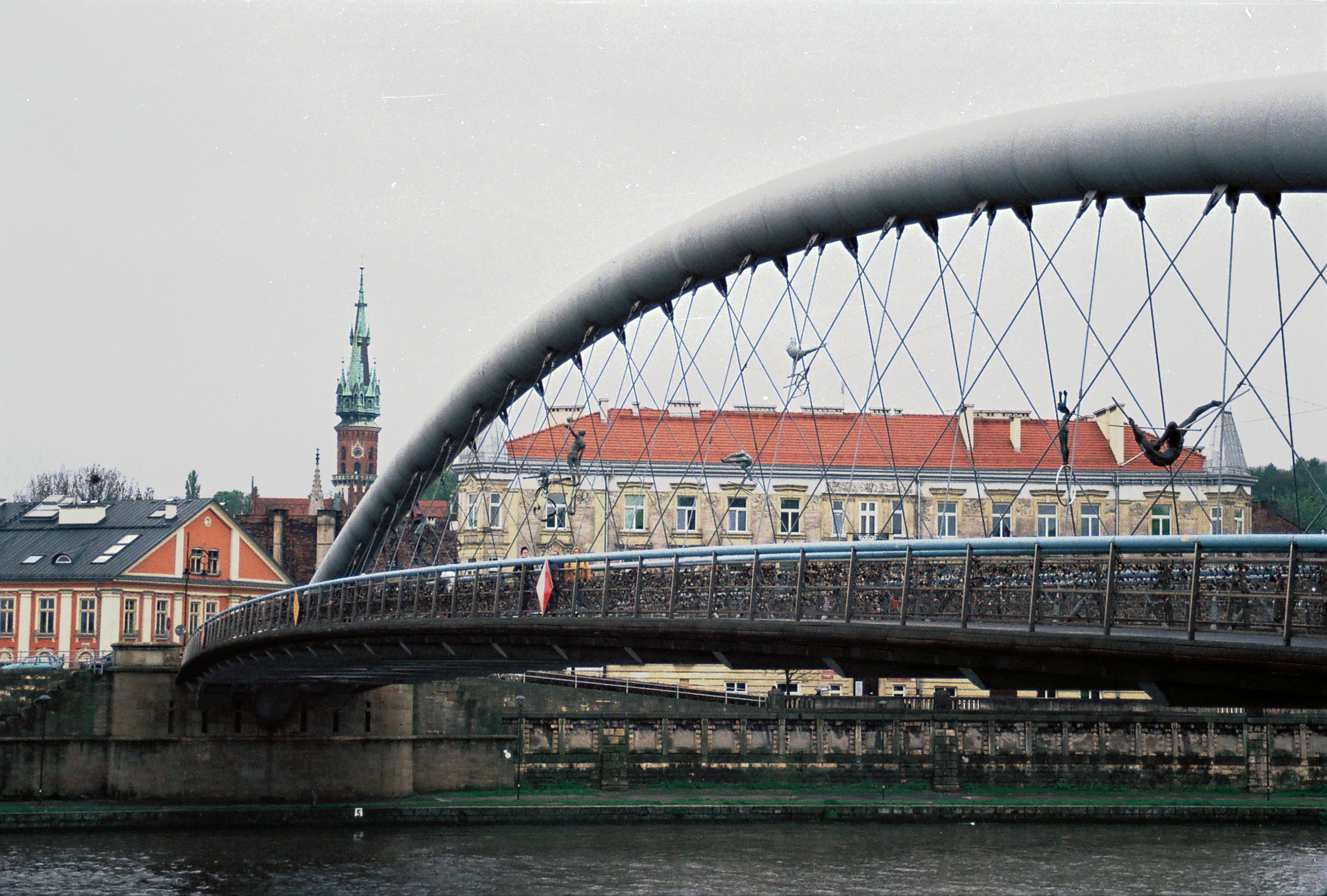 Kładka Bernatka Bridge spans the Vistula River in Kraków.