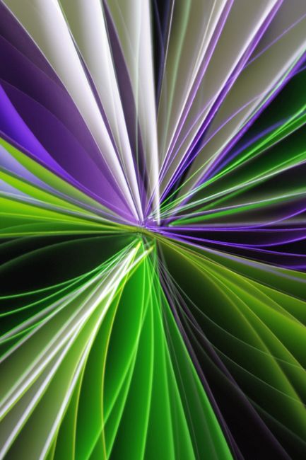 Dynamic abstract light art featuring green and purple rays radiating in an eye-catching design.