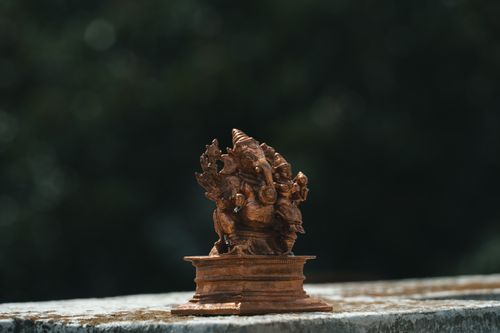 Free Intricate bronze statue of Lord Ganesha displayed outdoors, showcasing artistry and cultural heritage. Stock Photo