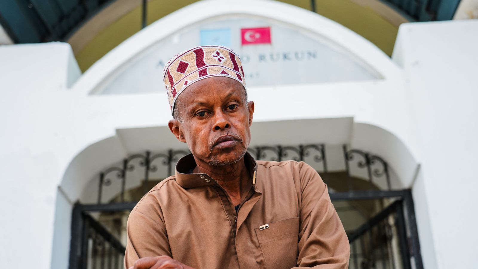 Portrait of somali man in front of mogadishu mosque