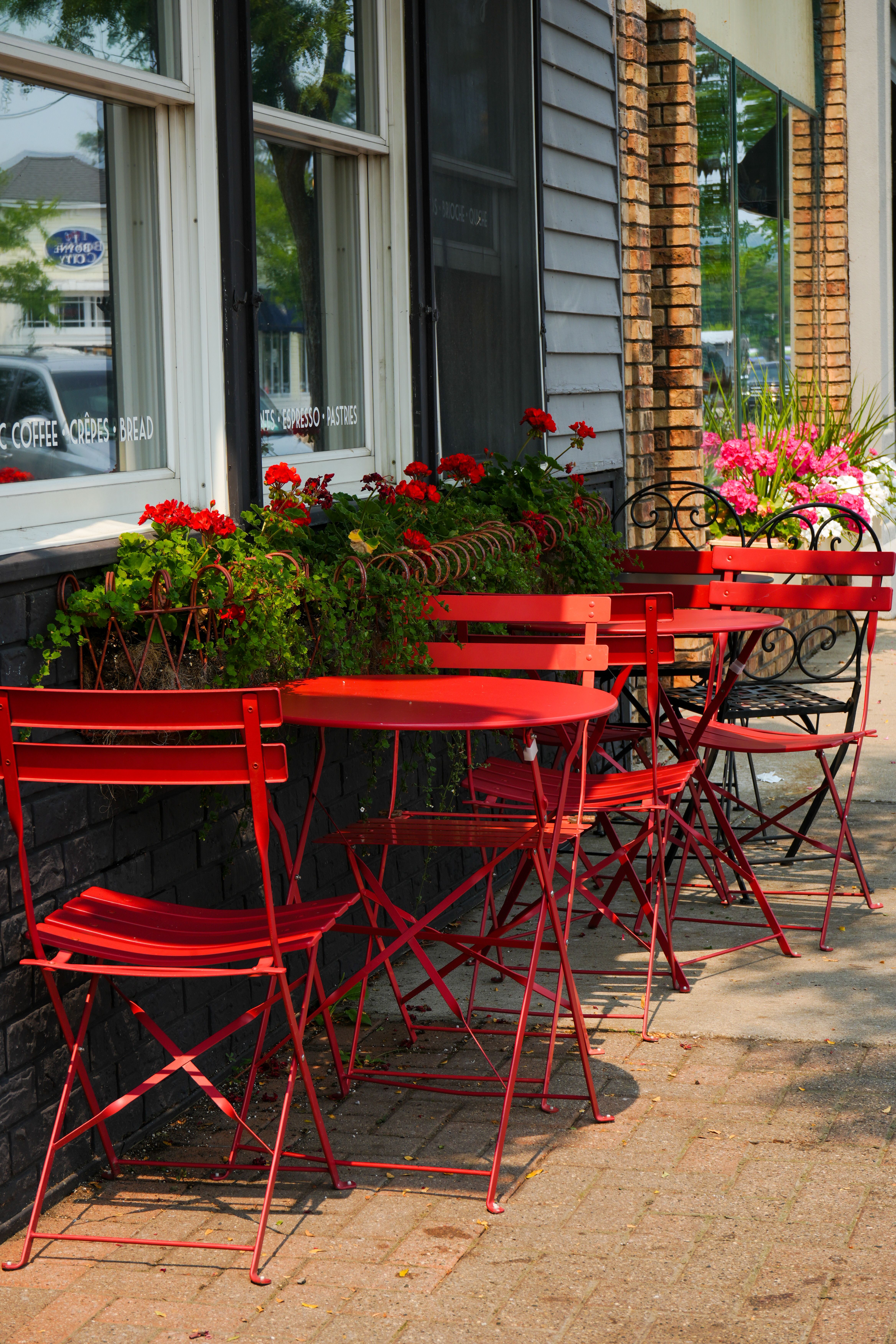 This photo shows a row of tables and chairs.