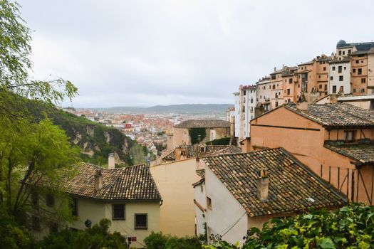 Charming view of historic Cuenca with traditional rooftops and scenic landscape, perfect for travel enthusiasts.