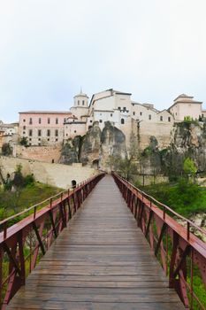 Stunning view of Cuenca's historic cityscape with traditional architecture and scenic bridge.