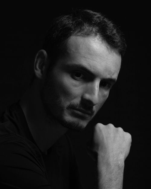 Free Moody black and white portrait of a man in deep thought, with dramatic lighting. Stock Photo