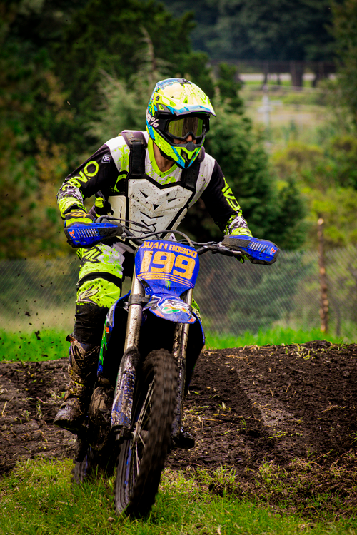 Free Dynamic motocross rider racing through a forest track in Mexico. Stock Photo
