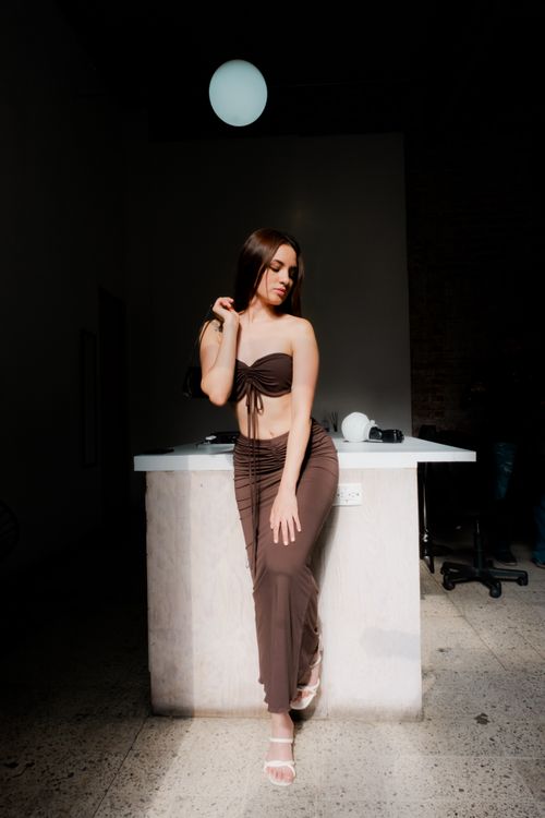 Stylish Woman Posing in Modern Interior Setting · Free Stock Photo