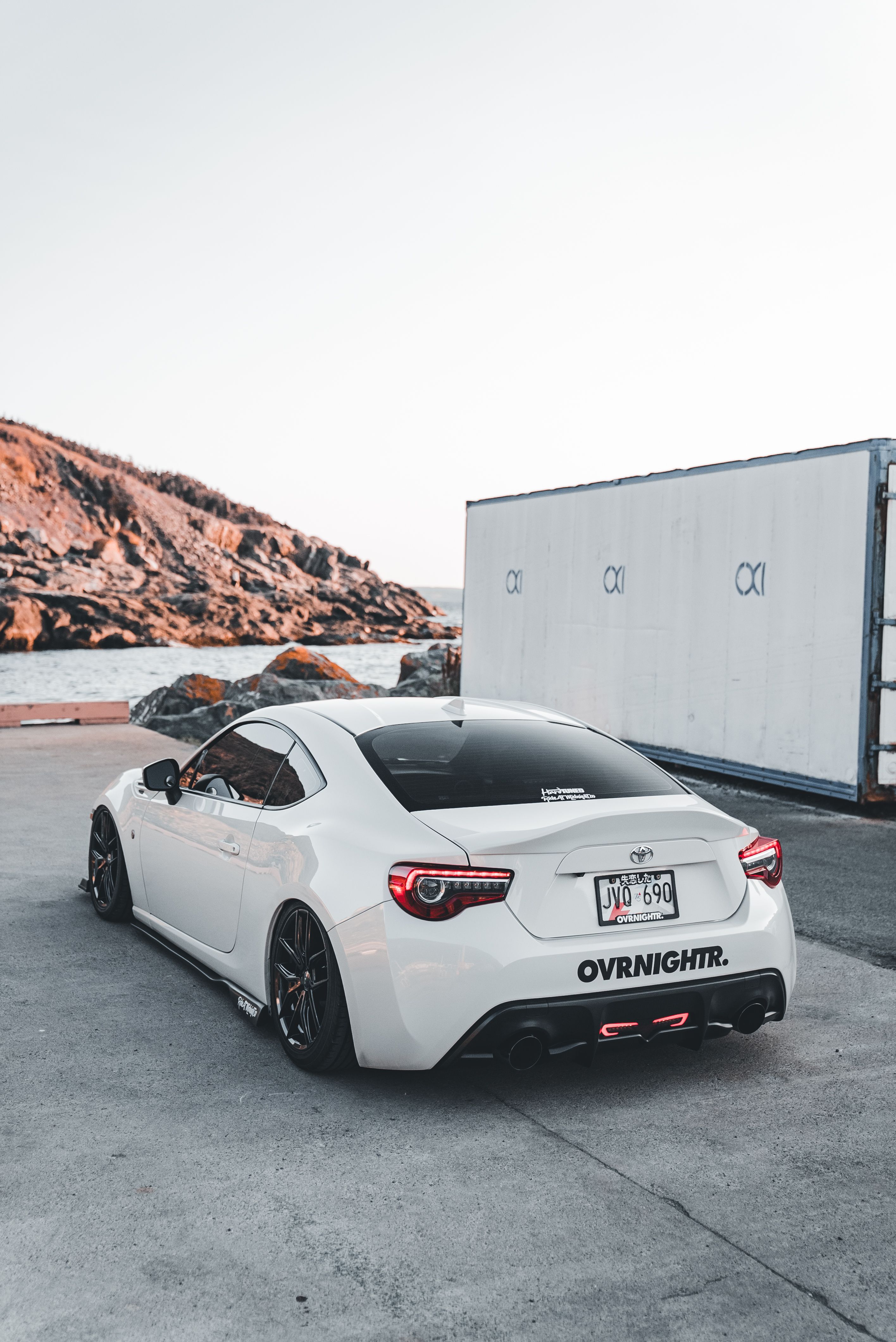 White Sports Car by the Waterfront · Free Stock Photo