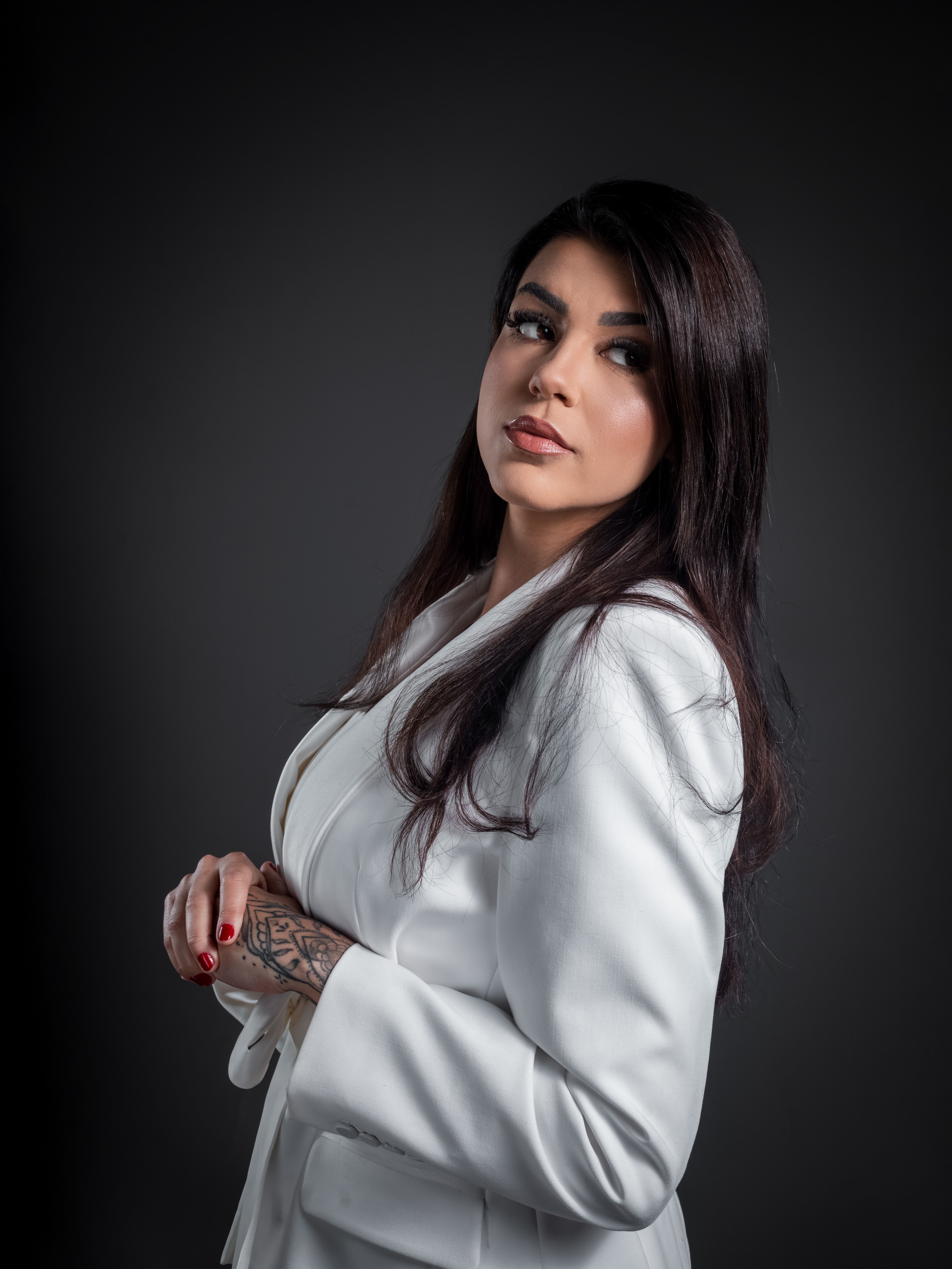 Elegant Portrait of Confident Woman in White Suit · Free Stock Photo