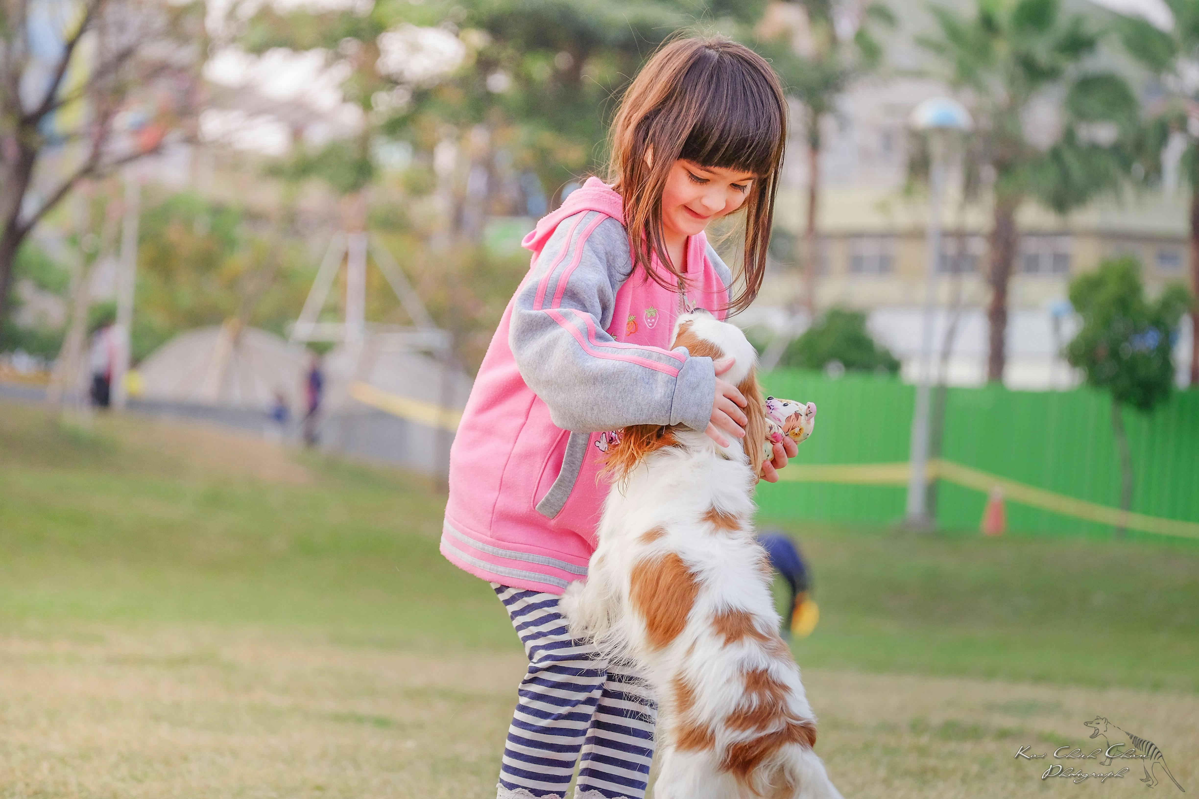 portrait of a smiling young woman with dog