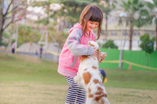 Portrait of a Smiling Young Woman With Dog