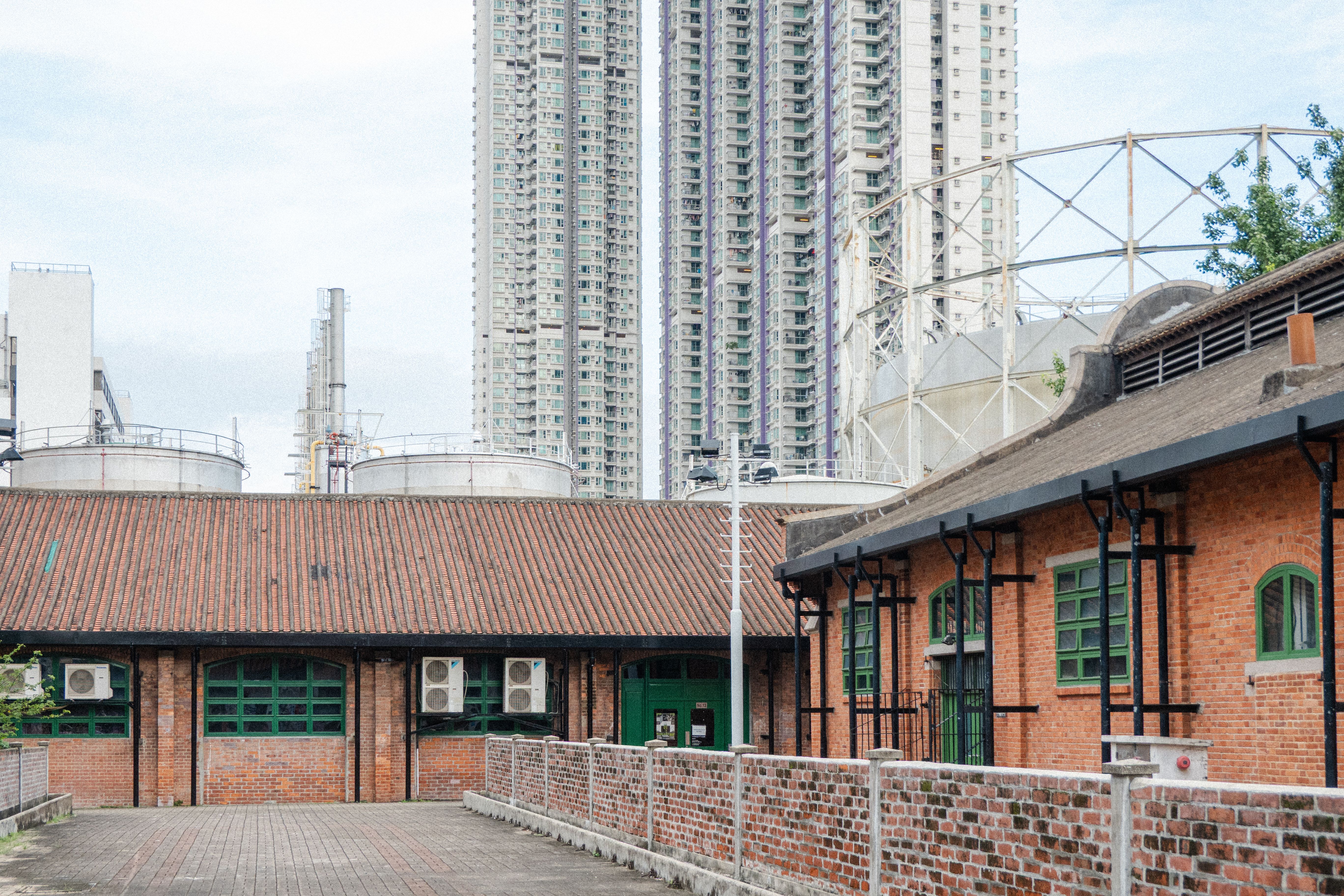 Old industrial buildings meet new skyscrapers in this Hong Kong urban scene.