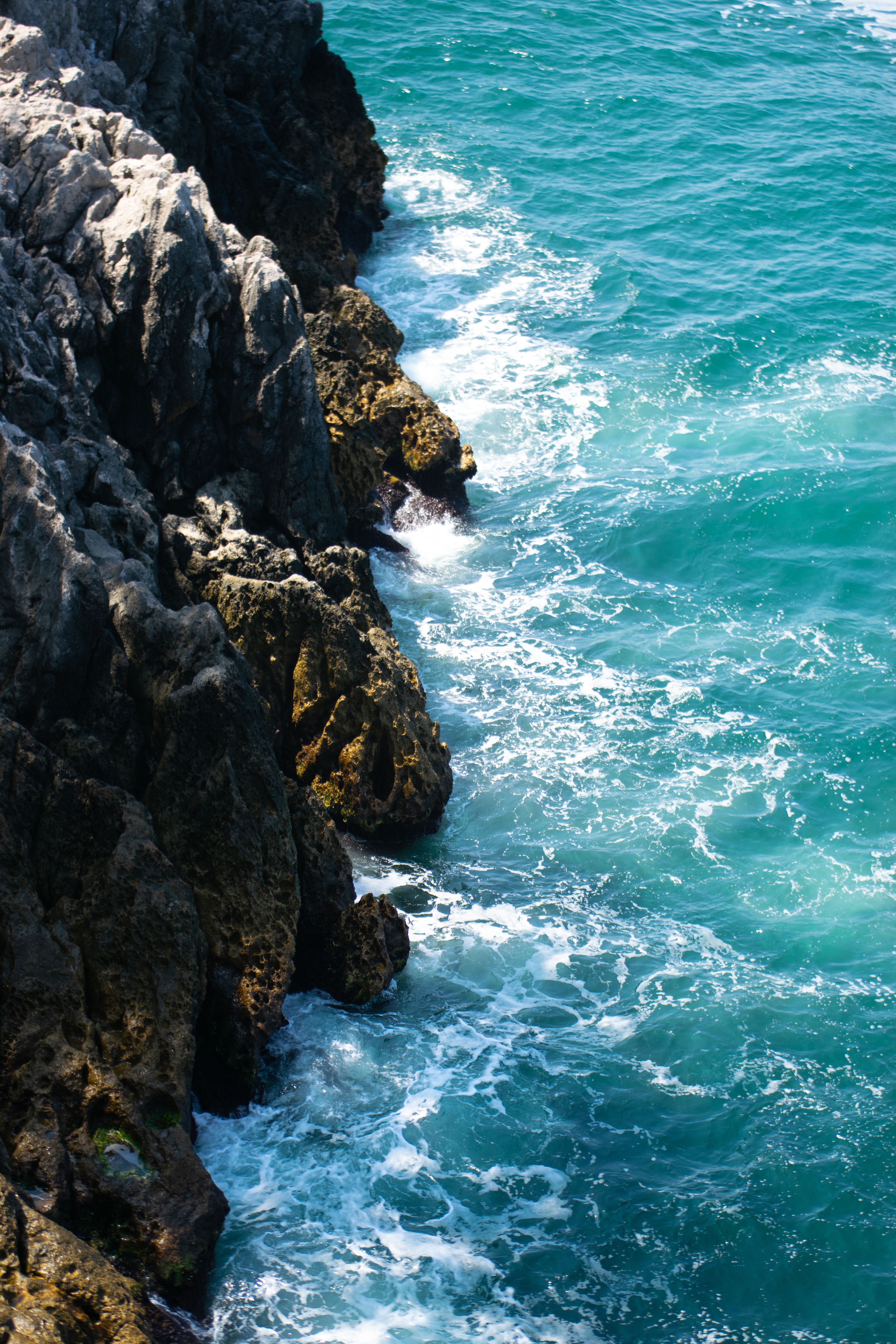 Ocean View With Black Rock Formation · Free Stock Photo