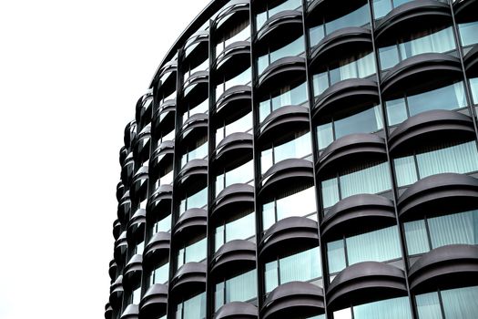 Elegant modern facade with geometric patterns in Barcelona, showcasing urban design.