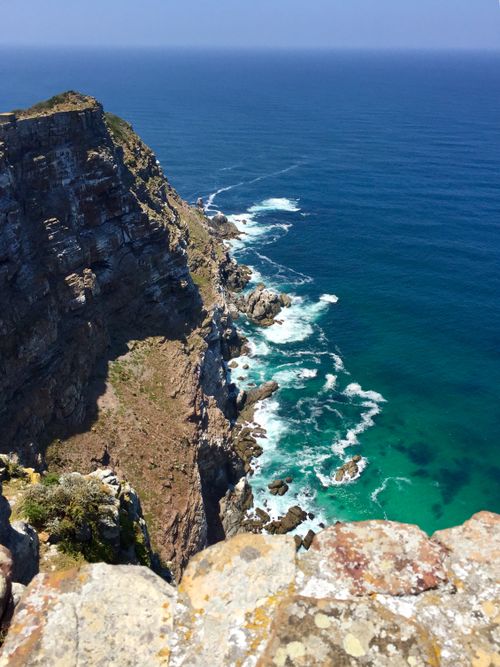 Free Dramatic cliffside and ocean view at Cape of Good Hope, South Africa under clear blue skies. Stock Photo