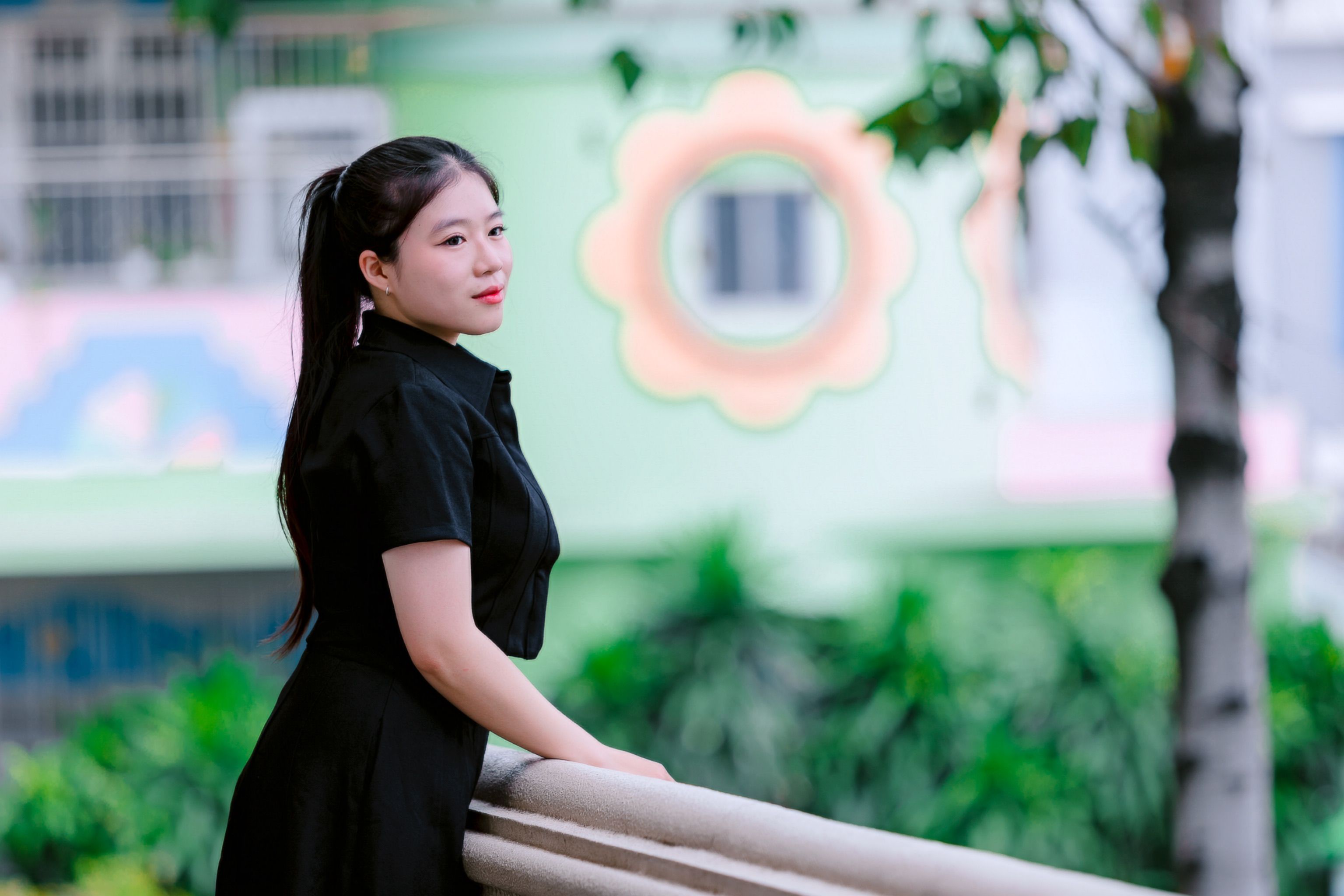 Young Woman in Urban Park with Colorful Background · Free Stock Photo