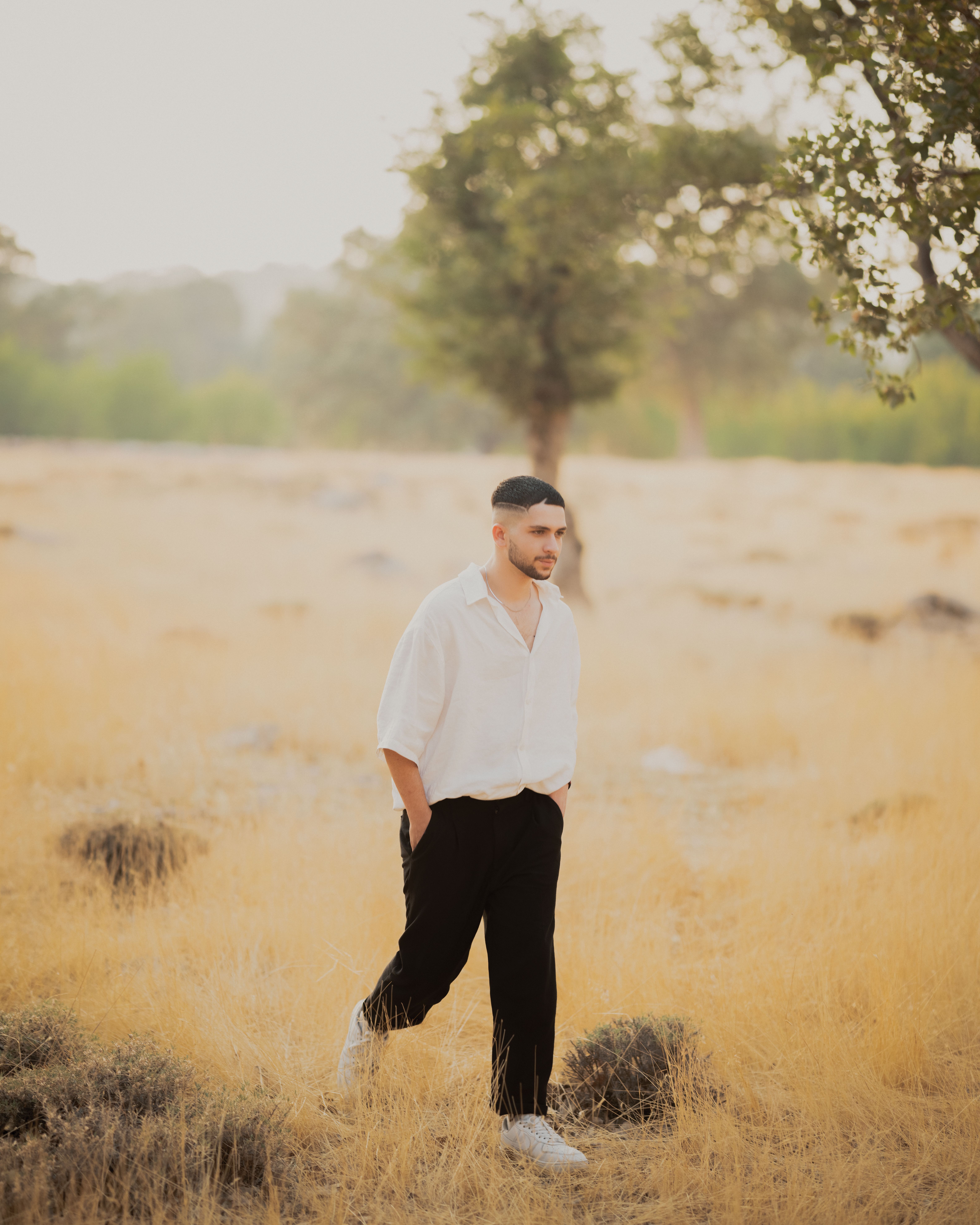Stylish Male Model in Natural Outdoor Setting · Free Stock Photo