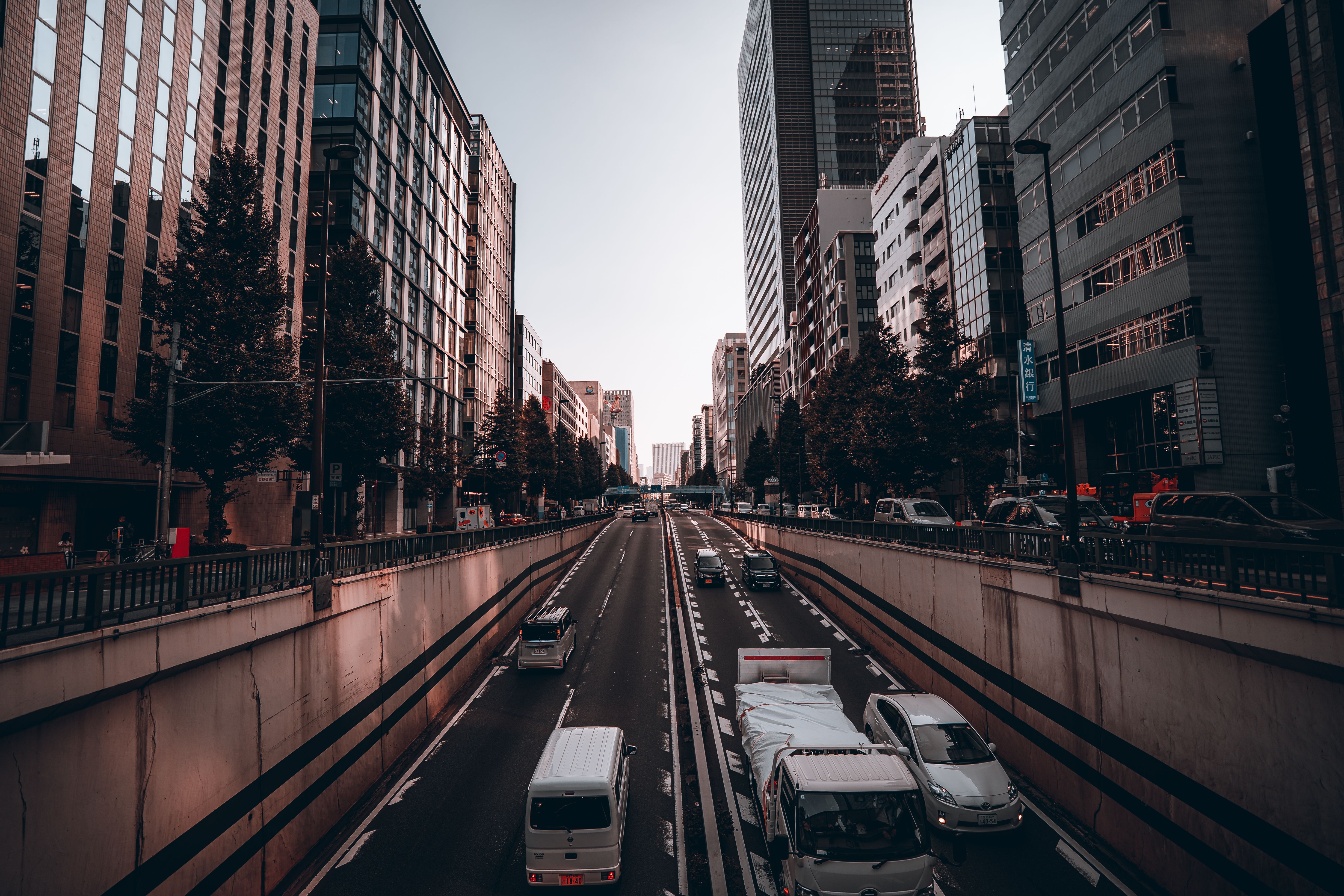 A bustling street view in Tokyo showcasing modern architecture and vibrant urban life.