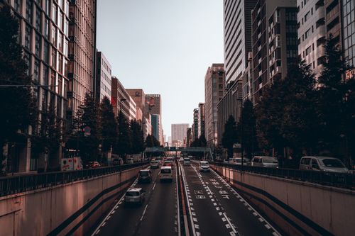 Free Vibrant Tokyo cityscape with busy street and high-rise buildings during the day. Stock Photo