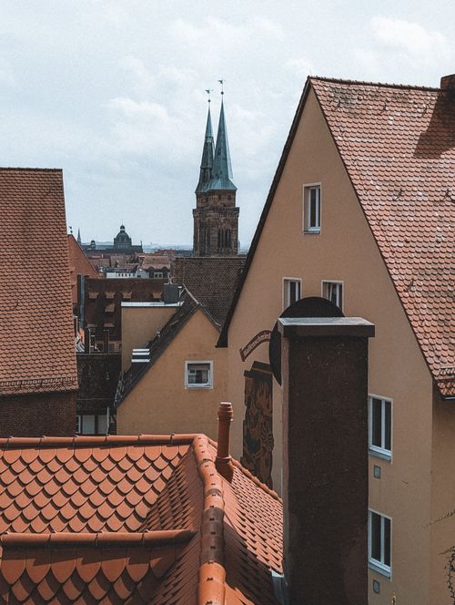 Free Explore the picturesque skyline of Nuremberg with historic architecture and vibrant rooftops. Stock Photo