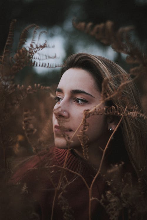 Free Photo Of Woman Standing Near Fern Plants Stock Photo