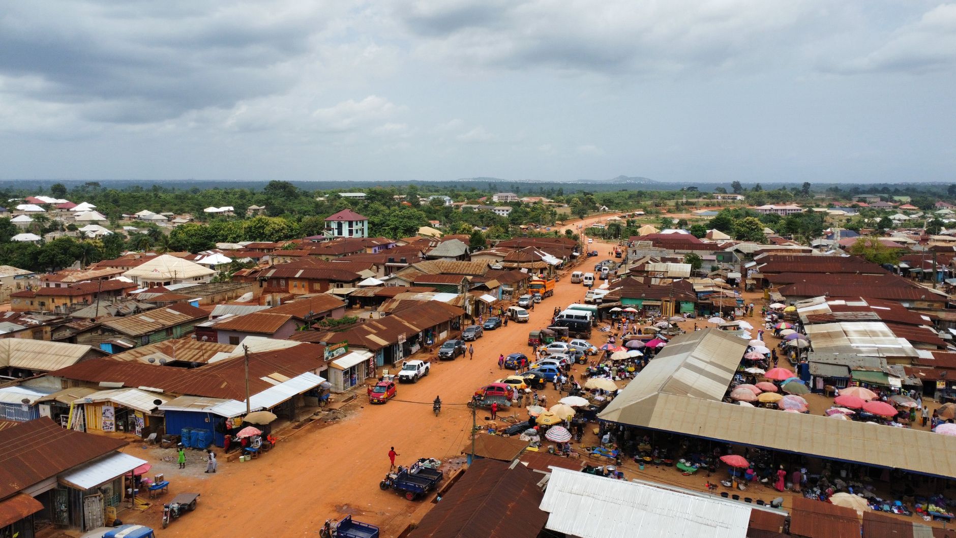 A vibrant aerial shot of a rural marketplace in Africa, showcasing daily life.