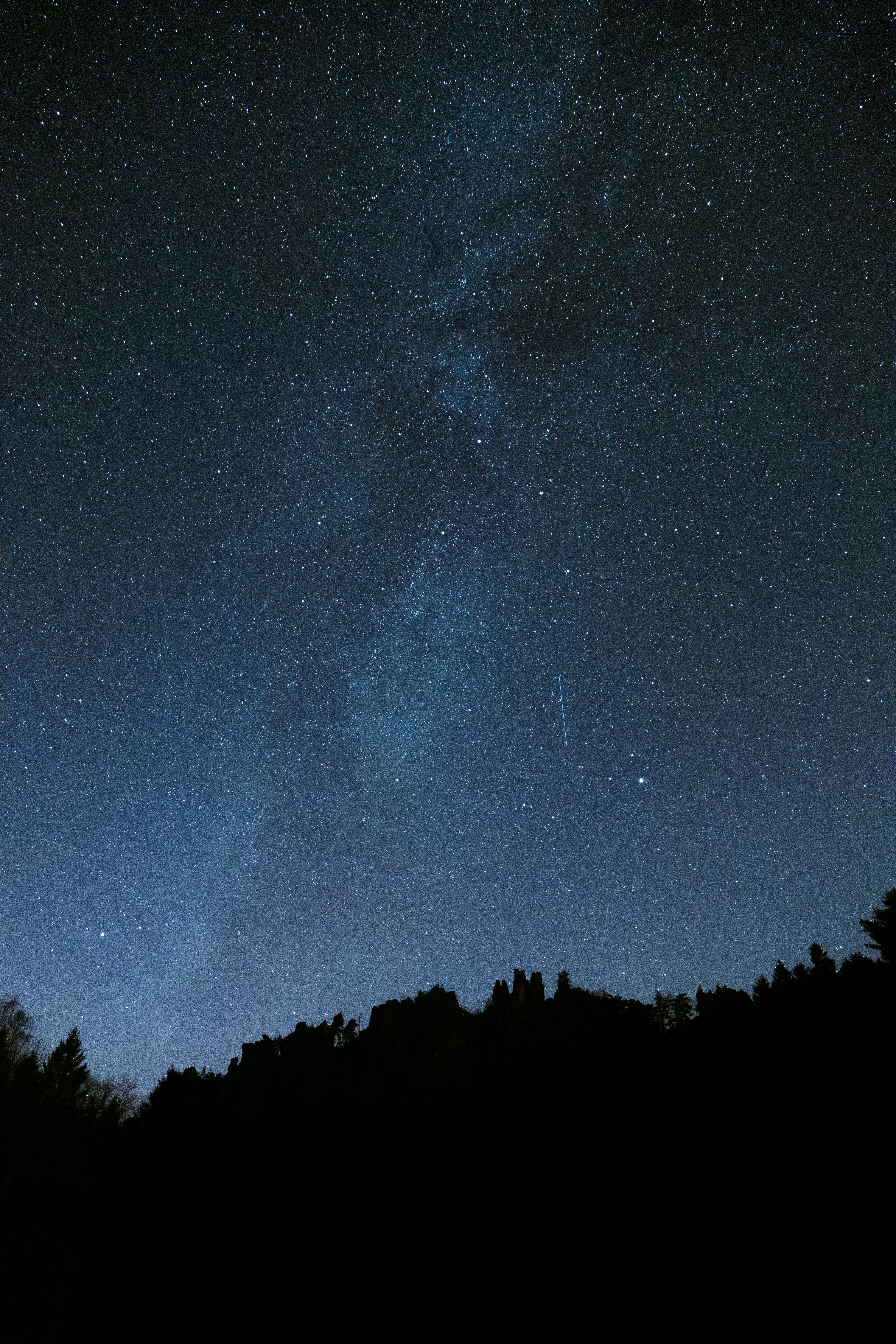 A breathtaking view of the Milky Way illuminating the night sky over Jonsdorf, Saxony, Germany.