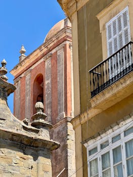 A vivid depiction of historic architecture in Cádiz, showcasing vibrant colors and classic Andalusian style.