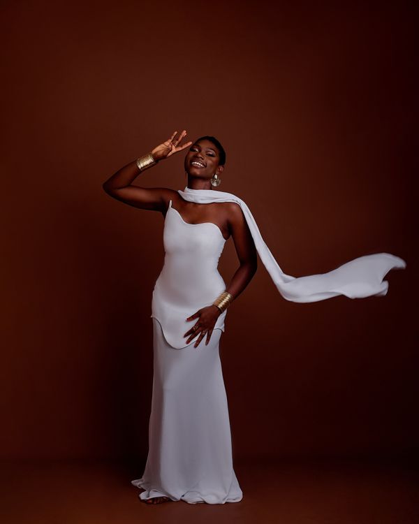 Elegant Woman in Flowing White Dress Posing Indoors Free Stock Photo Elegant Woman in Flowing White Dress Posing Indoors Free Stock Photo