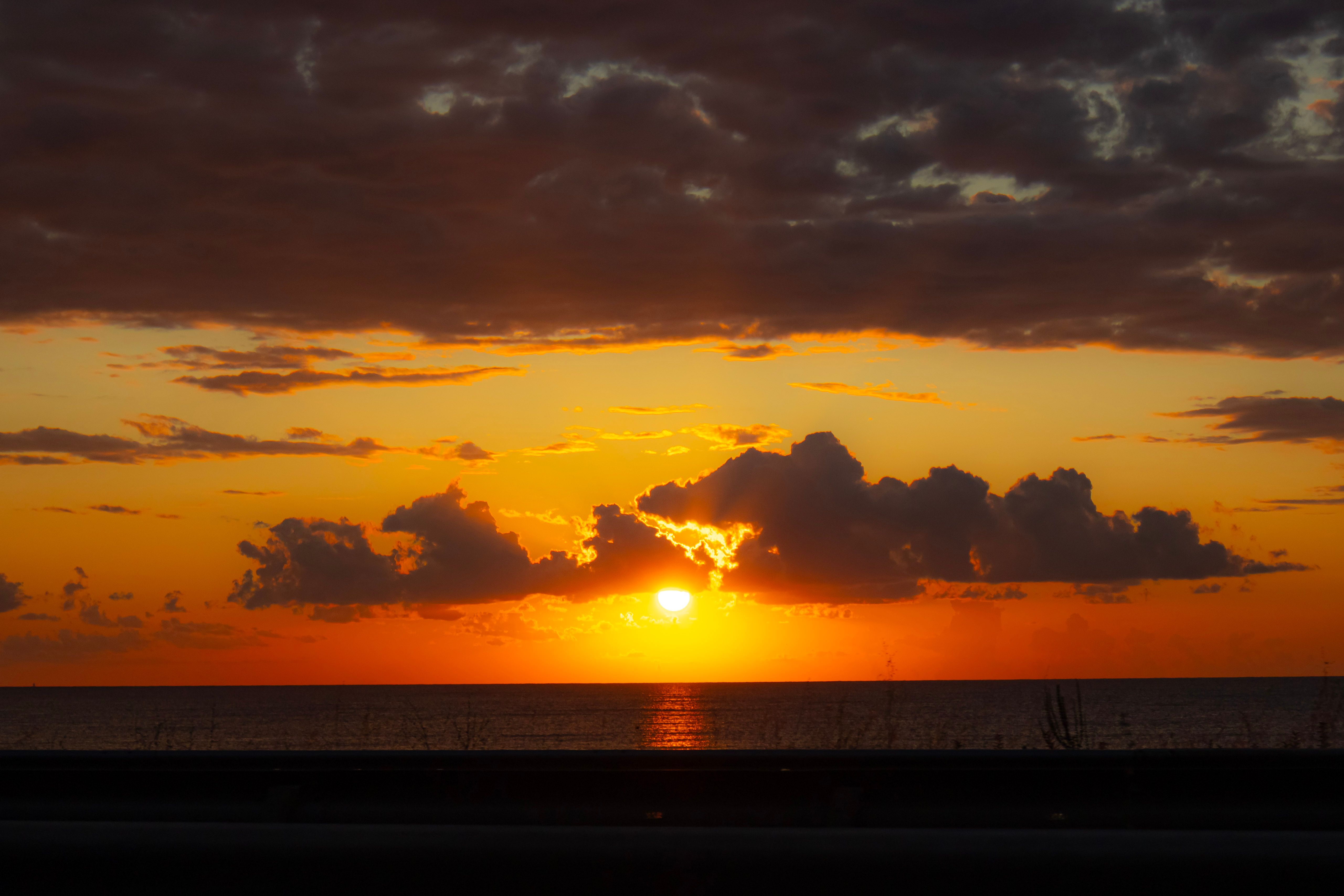 Vibrant sunset with dramatic clouds over the Black Sea in Giresun, Türkiye.