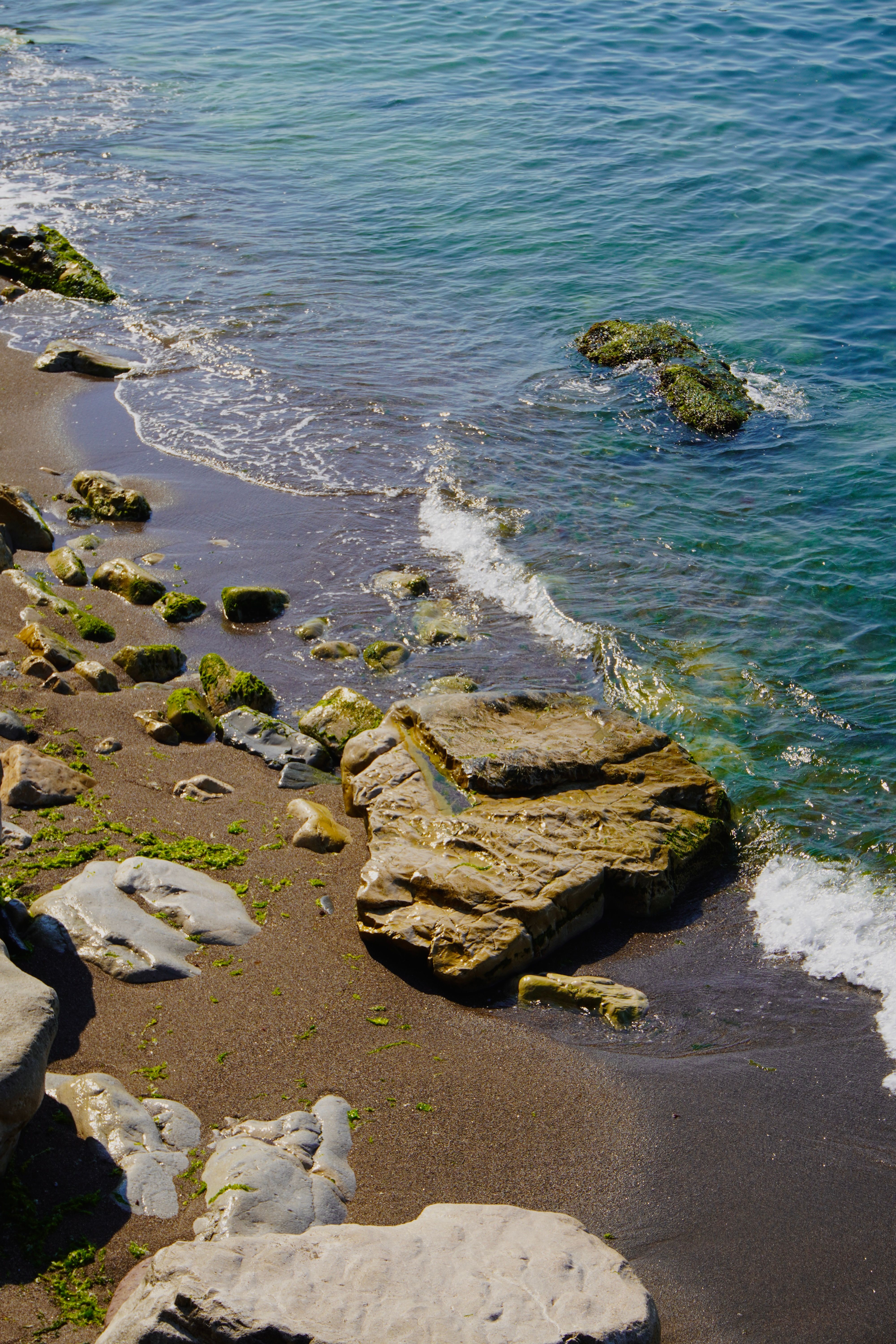 Rocky Shoreline with Clear Blue Ocean Waves · Free Stock Photo