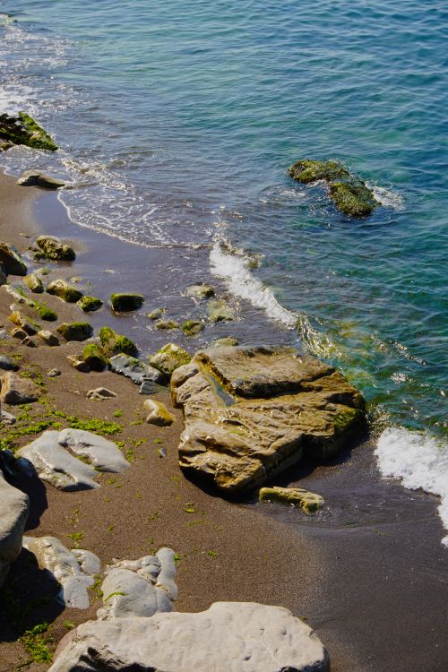 Rocky Shoreline with Clear Blue Ocean Waves · Free Stock Photo