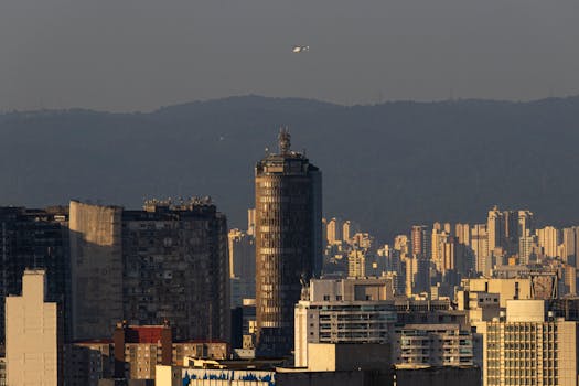 Stunning view of São Paulo skyline with a helicopter in flight during daytime.