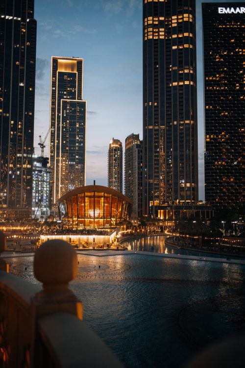 Free Evening view of Dubai Downtown skyline with illuminated skyscrapers and iconic architecture. Stock Photo