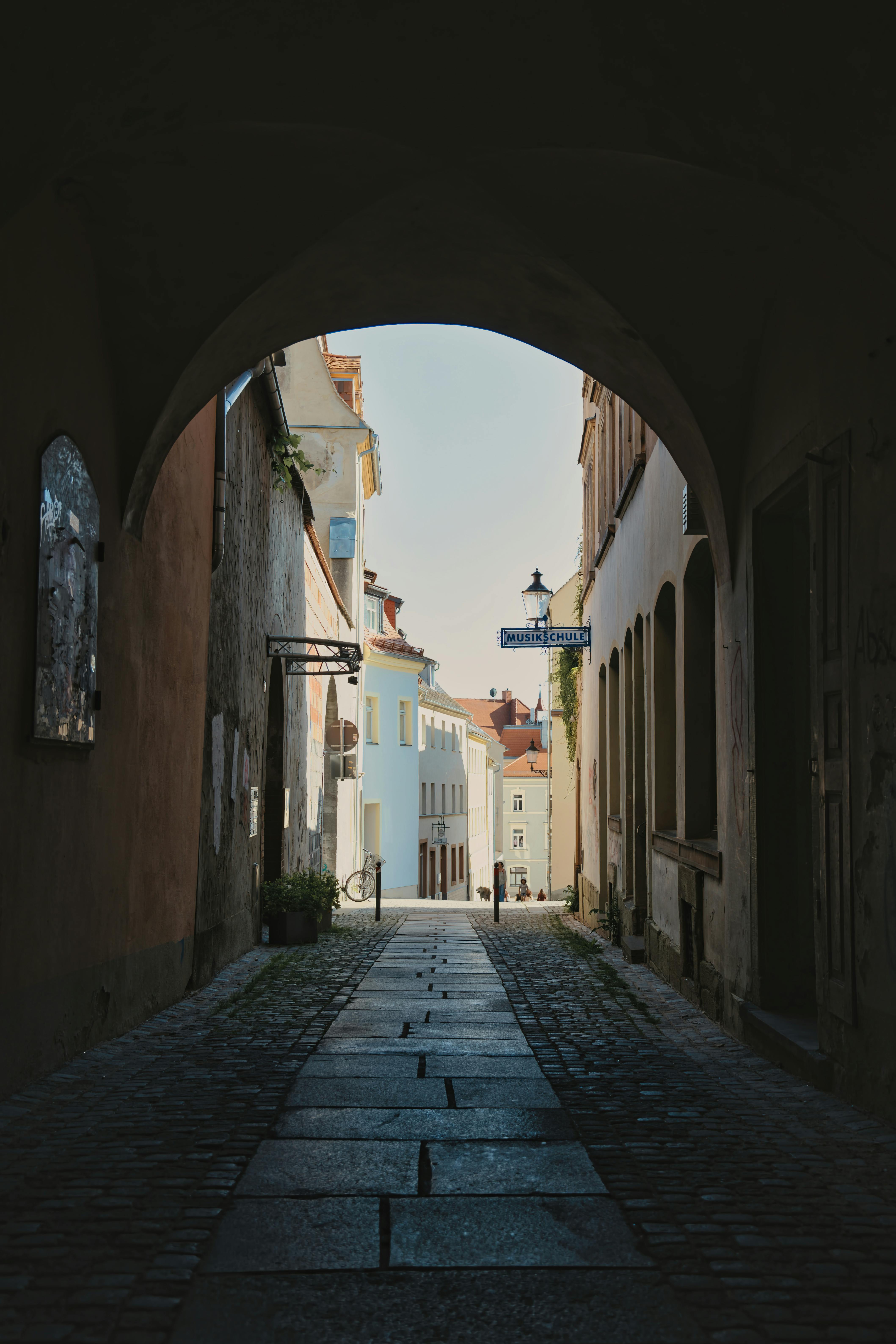 Discover the quaint beauty of an alleyway in Zittau with its classic architecture and inviting charm.