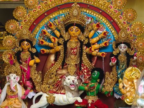Free Stunning Durga Puja idol displaying traditional artistry and vibrant colors in Kolkata. Stock Photo