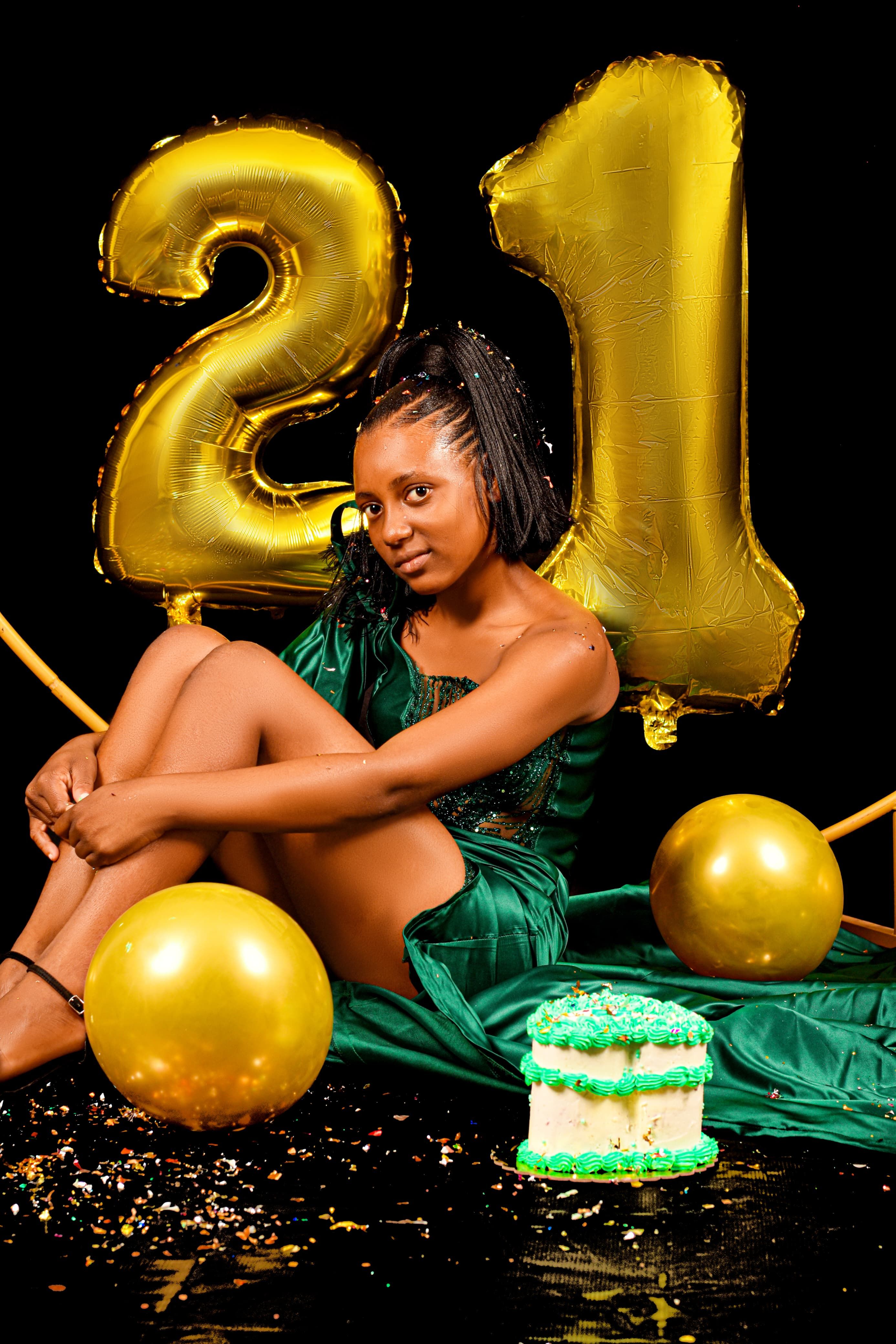 Stylish 21st birthday with balloons and cake, perfect for celebratory themes.