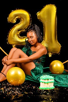 Stylish 21st birthday with balloons and cake, perfect for celebratory themes.