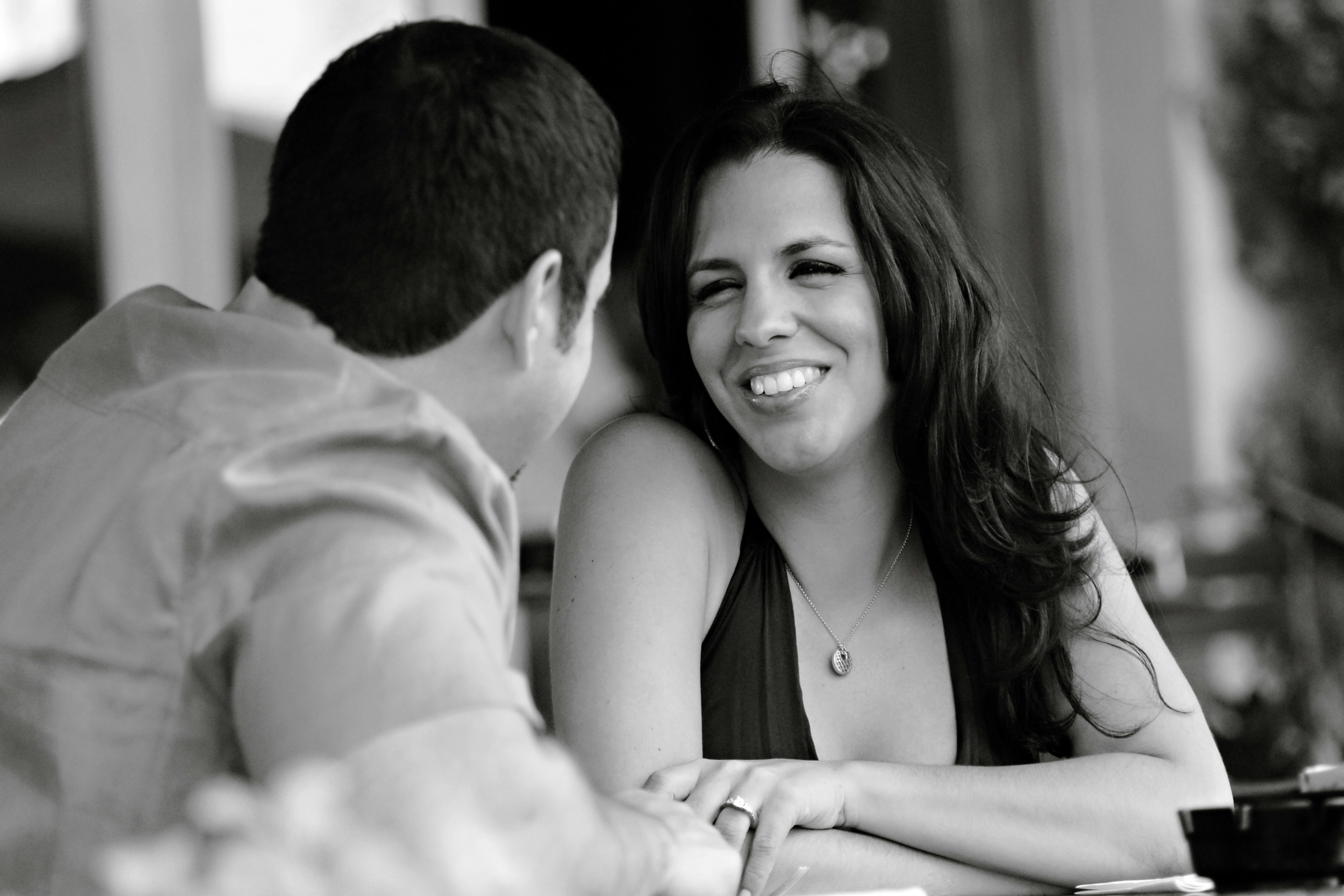Black and white photo of a happy couple sharing a moment together.