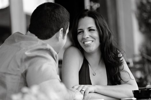 Black and white photo of a happy couple sharing a moment together.