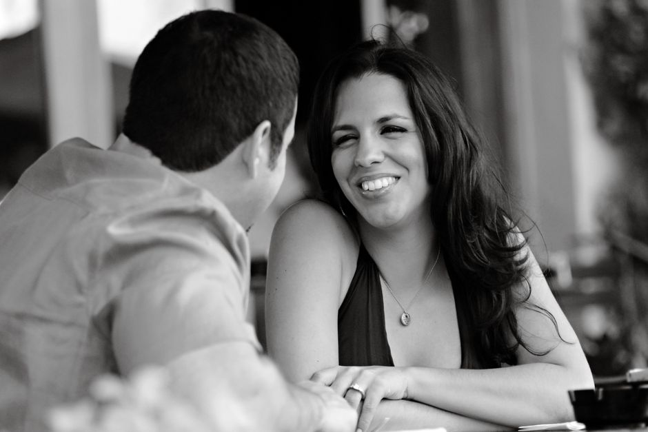 Black and white photo of a happy couple sharing a moment together.