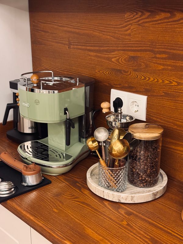 Home coffee bar with espresso machine in a small kitchen corner
