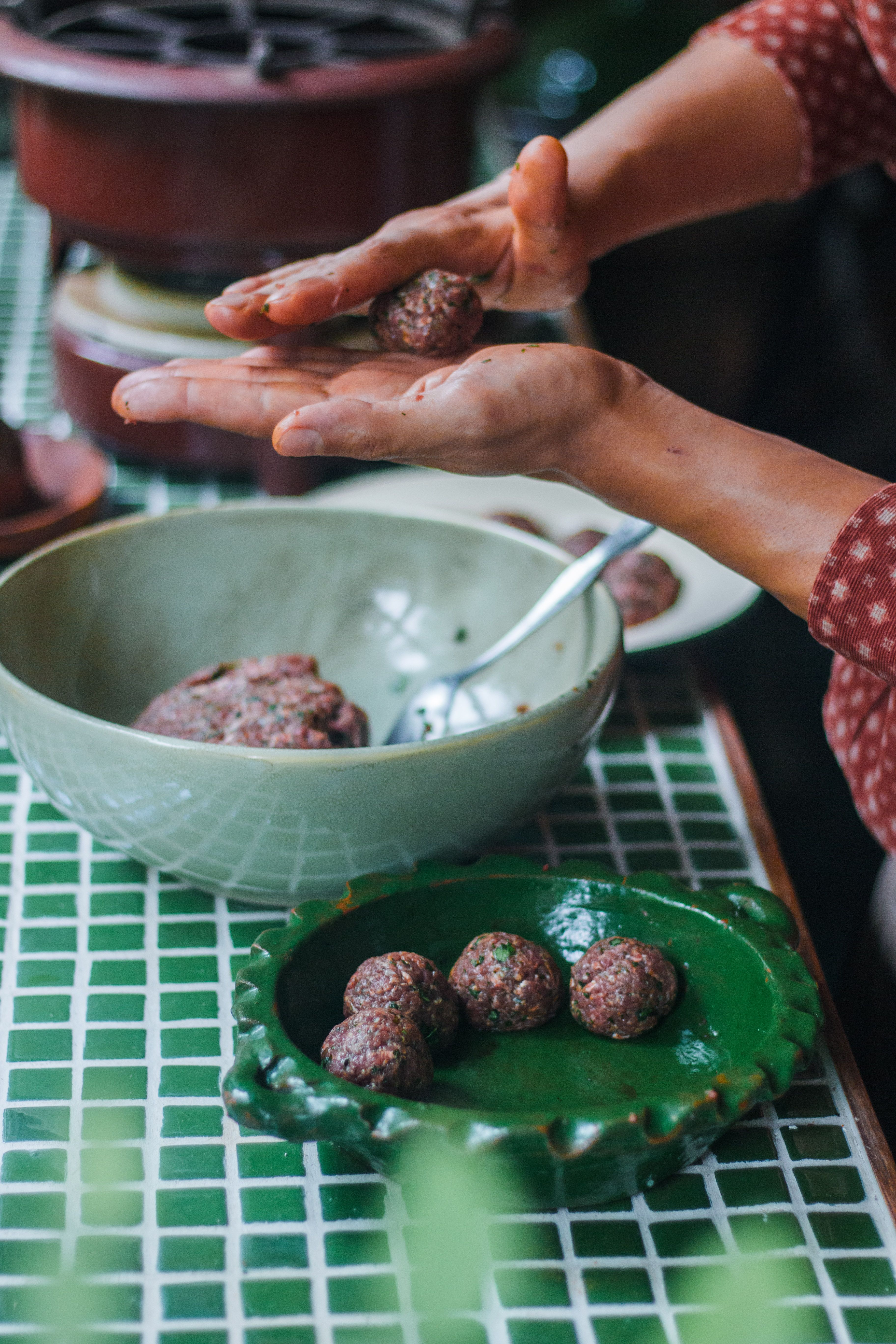 Hands Crafting Homemade Meatballs in Kitchen · Free Stock Photo