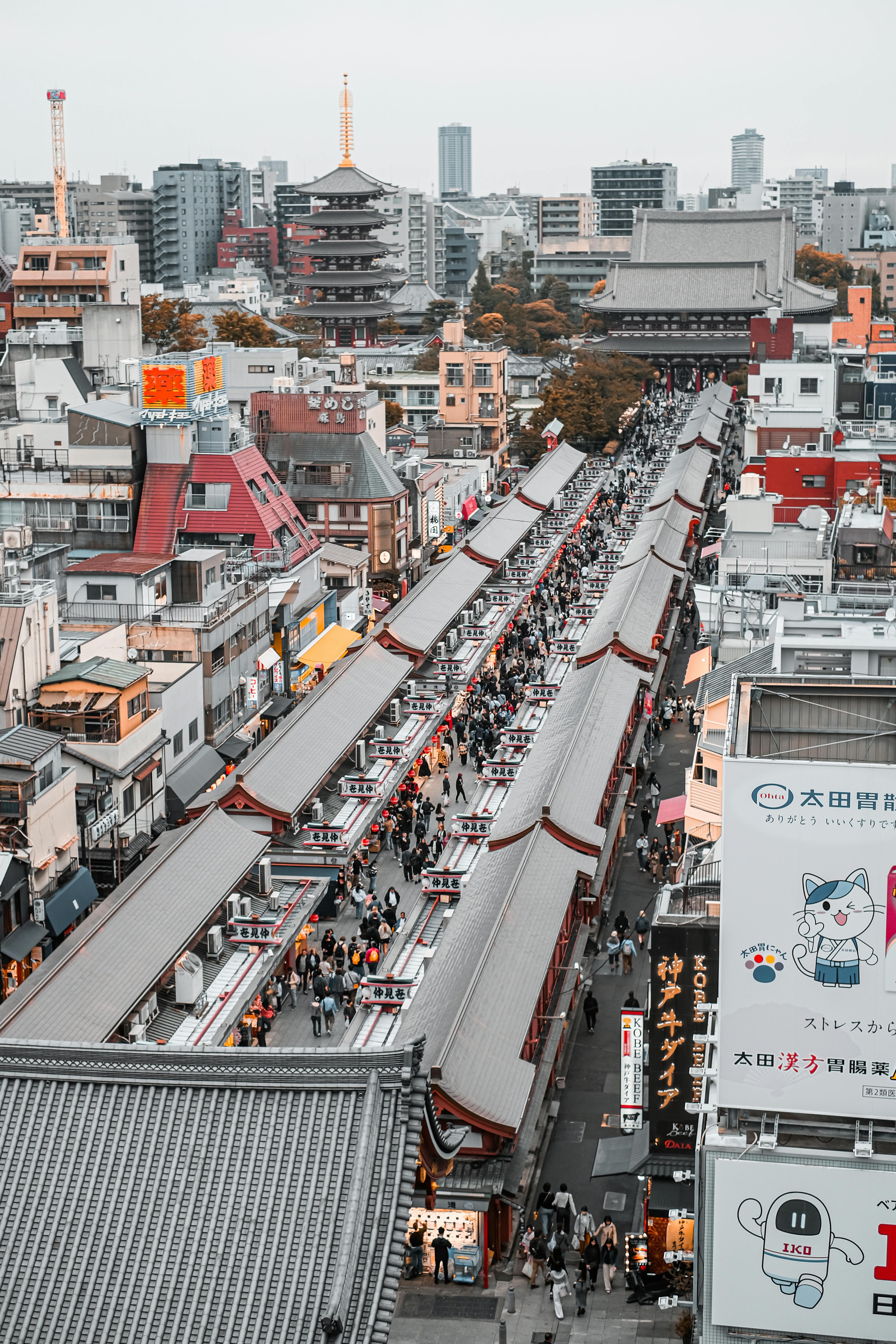 Explore the bustling Nakamise Shopping Street leading to Sensō-ji Temple in Tokyo.