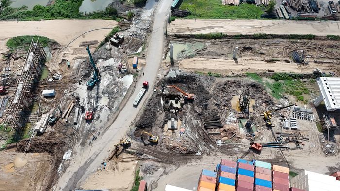 Busy construction site with heavy machinery from above
