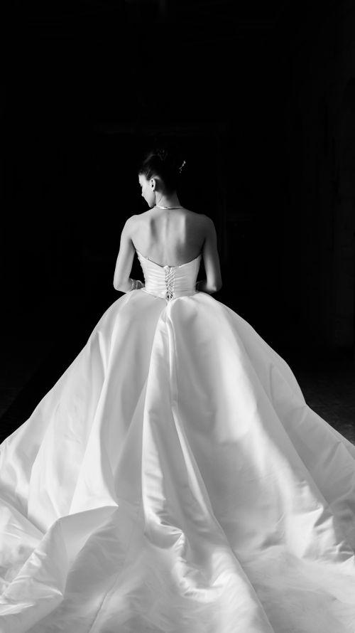 Free Stunning back view of a bride in a white gown, showcasing elegance and grace. Stock Photo