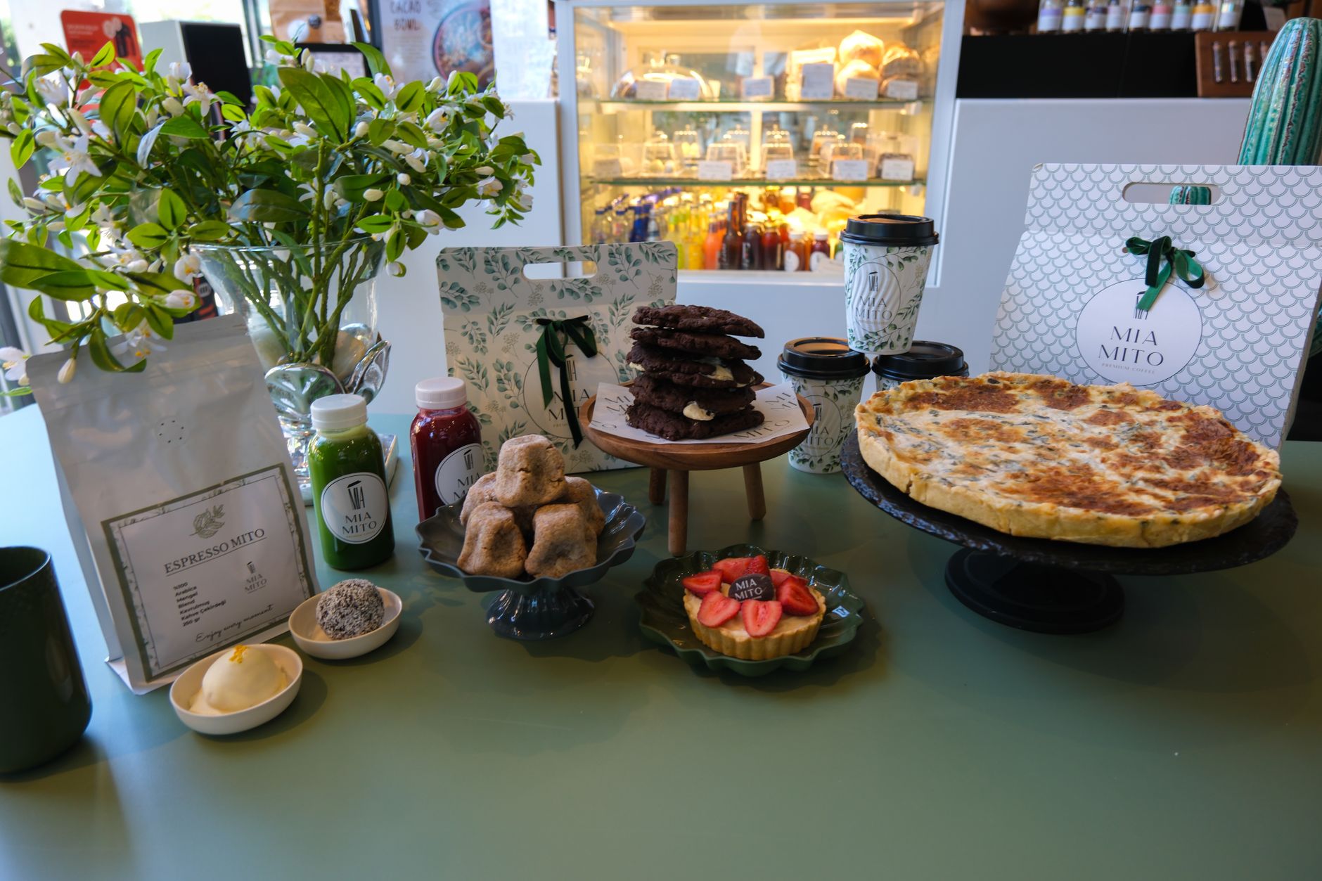 A colorful spread of desserts and drinks in a chic cafe setting in Ankara, Türkiye. Perfect for lifestyle and food themes.